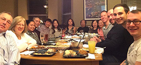 Group shot of international students at Thanksgiving dinner at local family's house