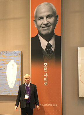 Northwestern President Morton Schapiro at a podium