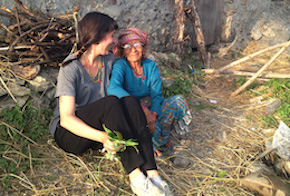 Two people sitting in a field