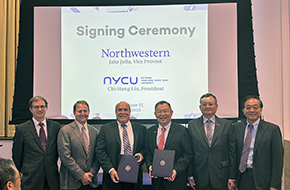 Group photo of leaders from NU and NYCU holding up the signed MOU