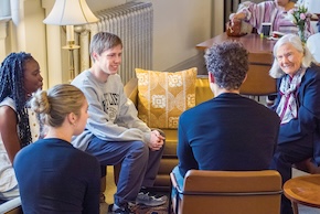 a group of Northwestern students talking to Roberta Buffett Elliott