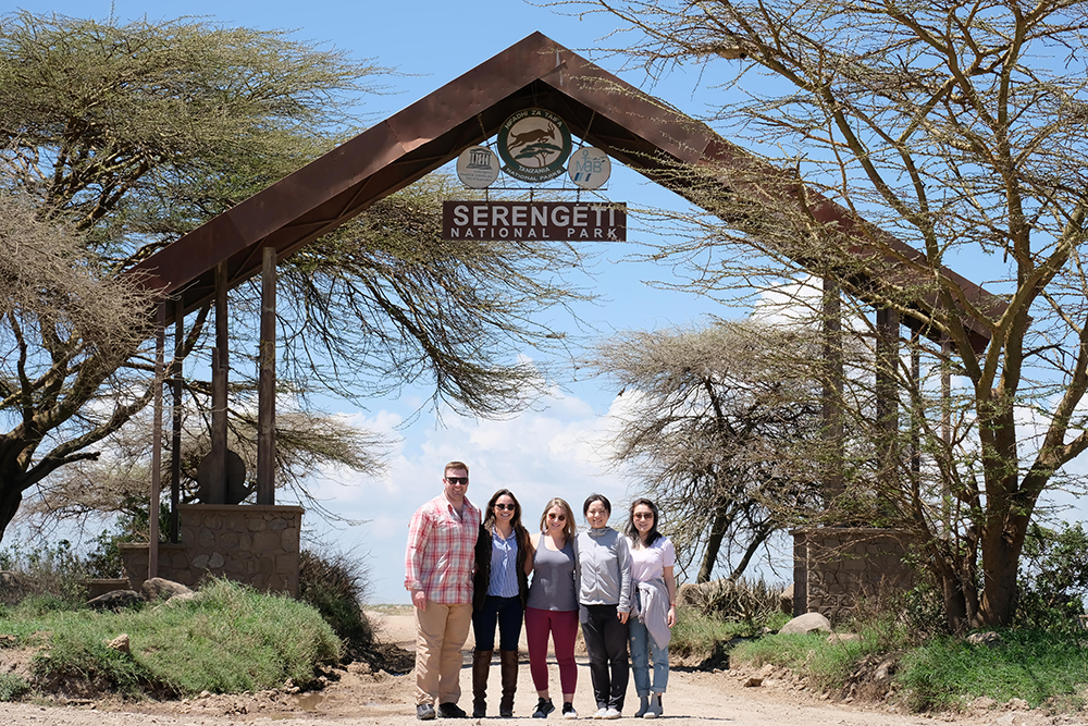 a-few-students-pose-at-the-gates-to-the-serengeti.jpg