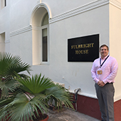 Northwestern's Greg Buchanan standing in front of Fulbright House in India