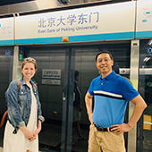 Shannon Pesek and Licheng Gu in front of the gate at Peking University