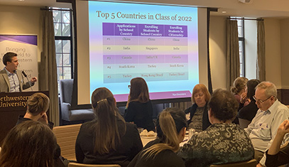 Aaron Zdawczyk speaking at a podium at an One World One Northwestern event