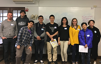 students in front of a white board