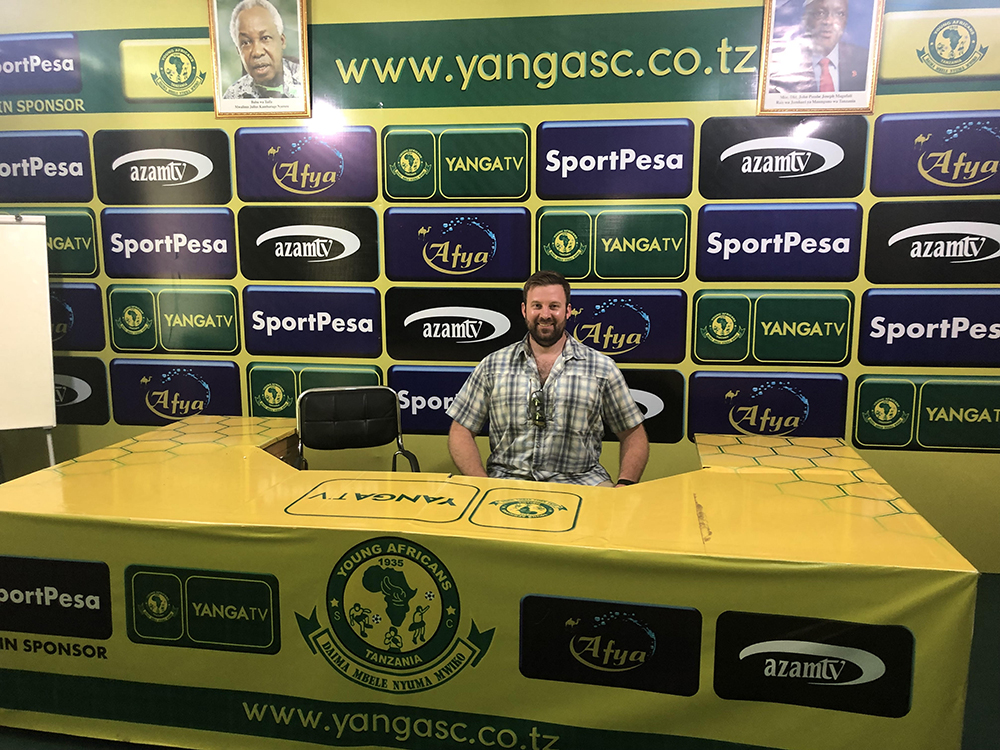 michael-bassi-sits-in-the-press-room-at-the-young-africans-football-club.jpg