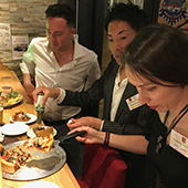 NU Club of Japan members enjoy pizza