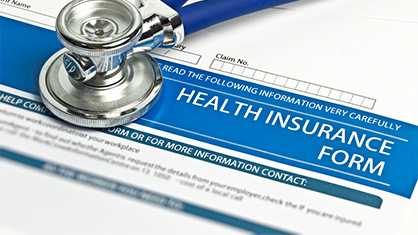 health insurance form and stethoscope