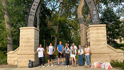 students in front of Weber Arch