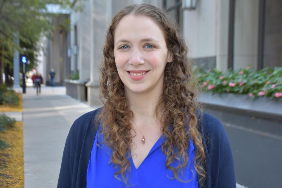 Edeth Engel, Lead IRB Analyst smiling at the camera in a blue top