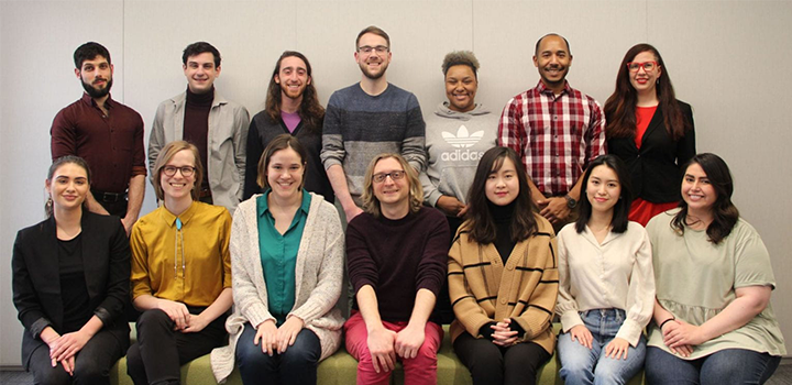 Faculty and staff on the EDIT Team sit and stand in two rows.