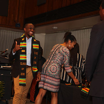 a student receiving his stole at JOY