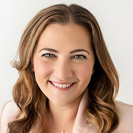 woman with dark blond hair smiling