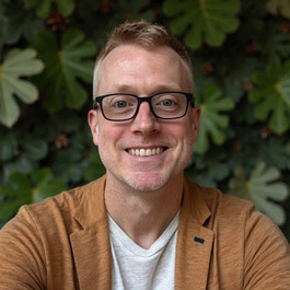 blond-haired man smiling
