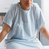 Woman in hospital gown
