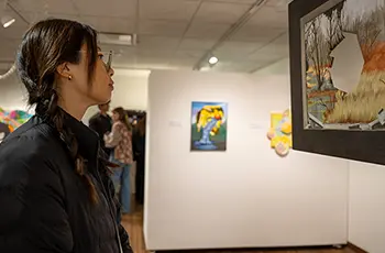 student at exhibit