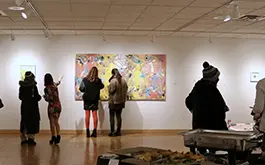 people looking at art at the gallery
