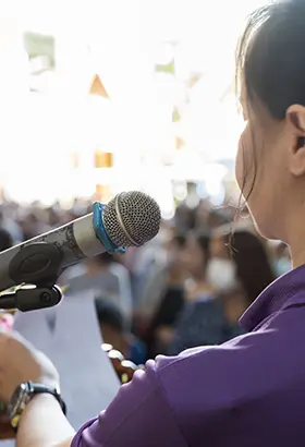 speaker speaking in the microphone