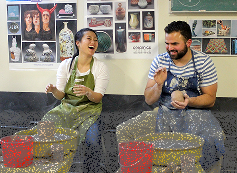 students at pottery wheels