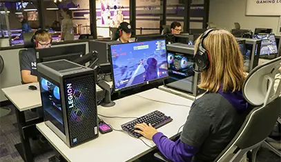 student playing a computer game in the lab