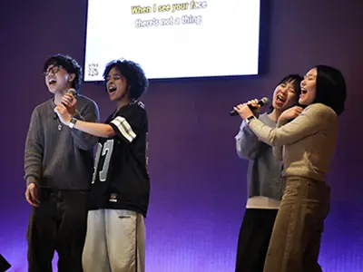 students singing karaoke