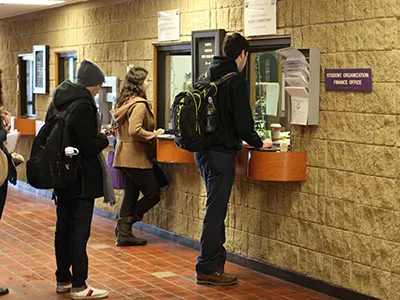 Student waiting in line at a cashier's window