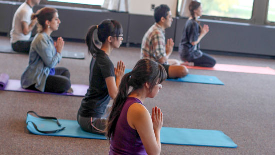 students doing yoga
