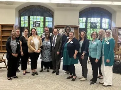 Schill smiling with staffers