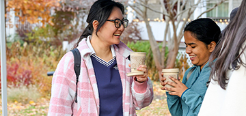 students talking off campus