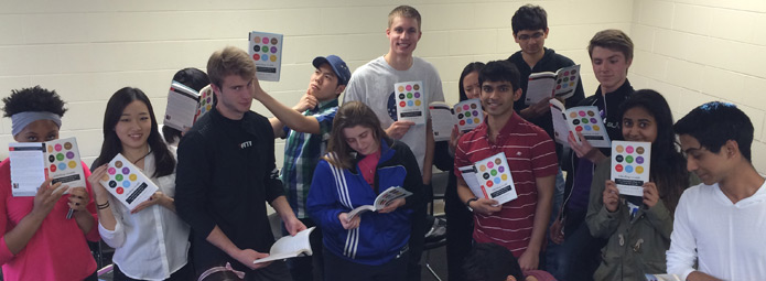 Students posing with Whistling Vivaldi books