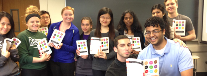 Students holding Whistling Vivaldi books in a classroom