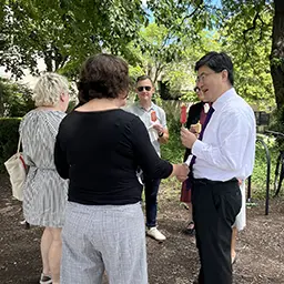 On a hot summer day, President Chiang chats with staff at an ice cream social hosted by the Northwestern University Staff Advisory Council (NUSAC).