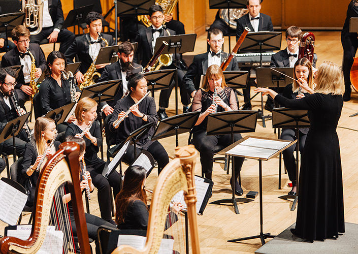 Image of Northwesten's Symphonic Wind Ensemble playing during the guest entrance.