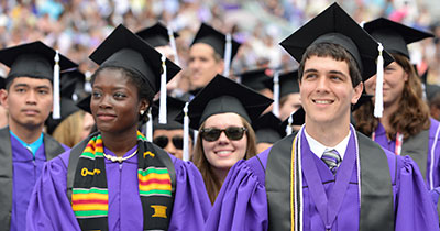 Undergraduates standing at commencement