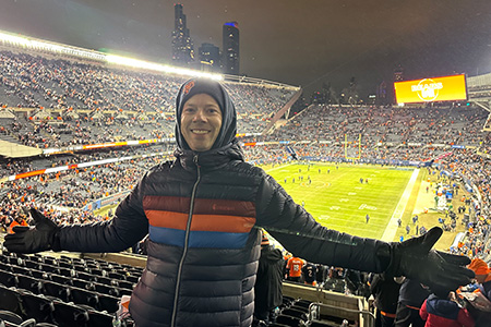 man in a stadium smiling