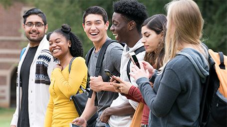 diverse group of students talking happily