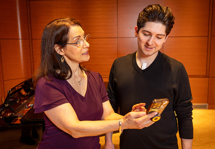 Theresa Brancaccio with vocalist testing device