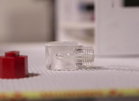 Small vial of radioactive material tipped over and spilled on lab bench
