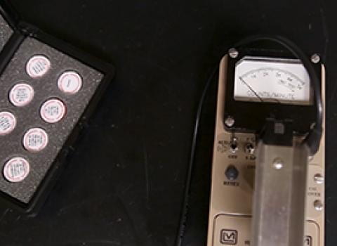 Geiger counter and sealed sources on a lab bench