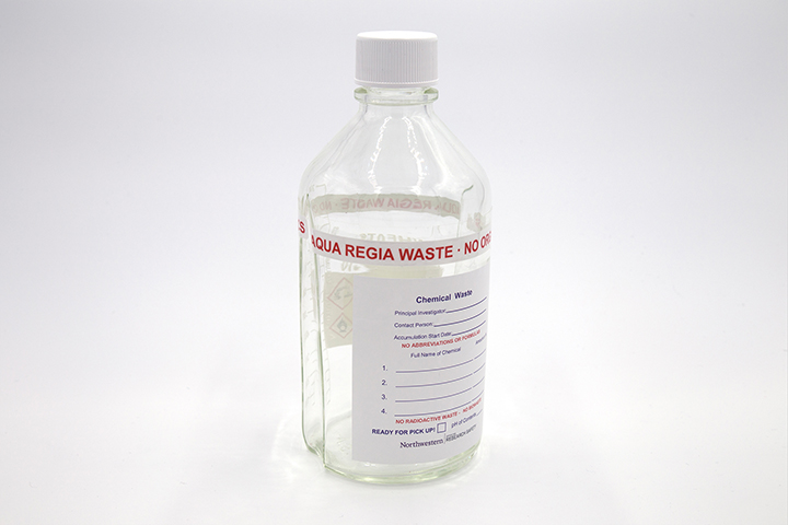 Glass bottle with aqua regia waste label