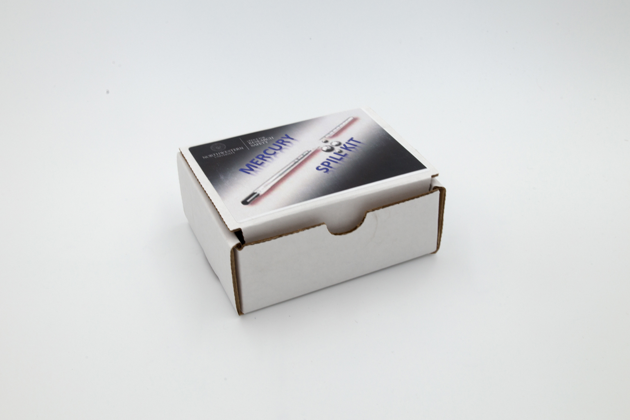 White cardboard box with a "mercury spill kit" label