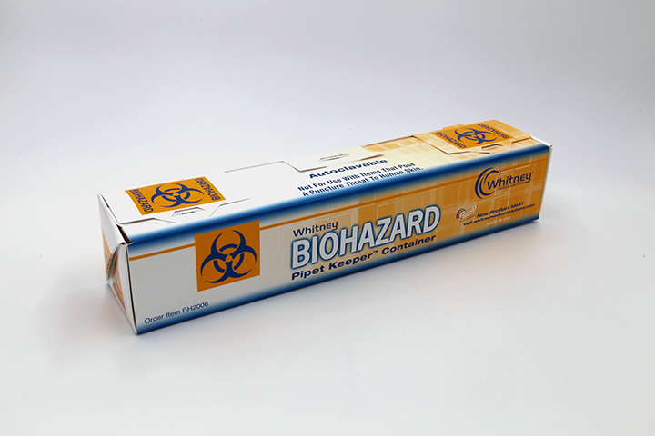 Orange and white cardboard box for pipettes