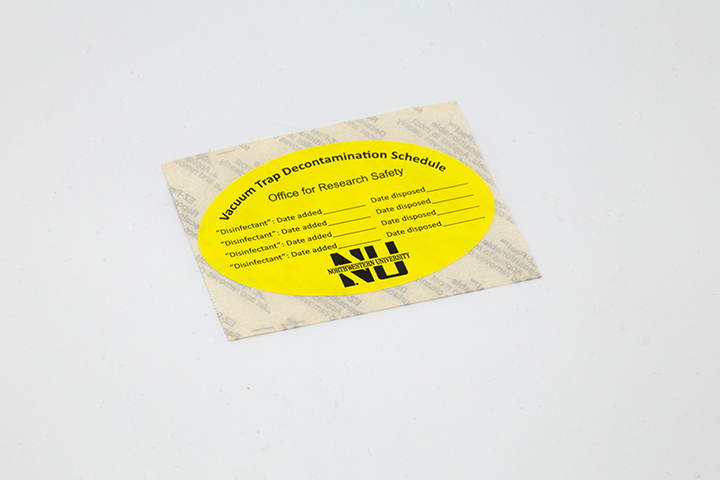 Yellow circular label for vacuum trap