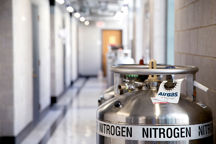 Several large liquid nitrogen dewars arranged in a long hallway