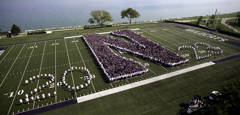 Birdseye view of class of 2023 on field