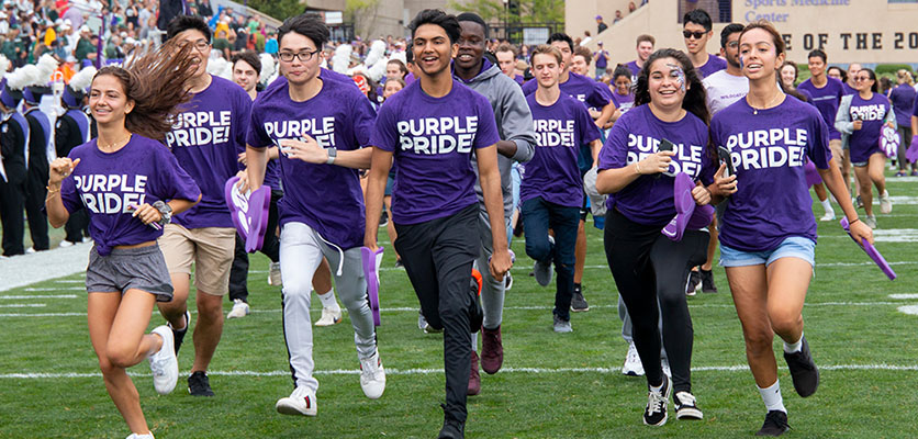 Students dash onto Ryan Field