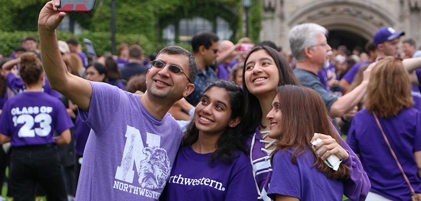 Student takes selfie with parents