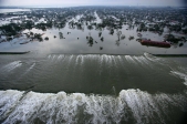 Floodwaters from Hurricane Katrina pour through a levee near downtown New Orleans.