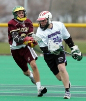 Northwestern midfielder Tim Gillard drives past a defender during a men’s club lacrosse game at Northwestern.